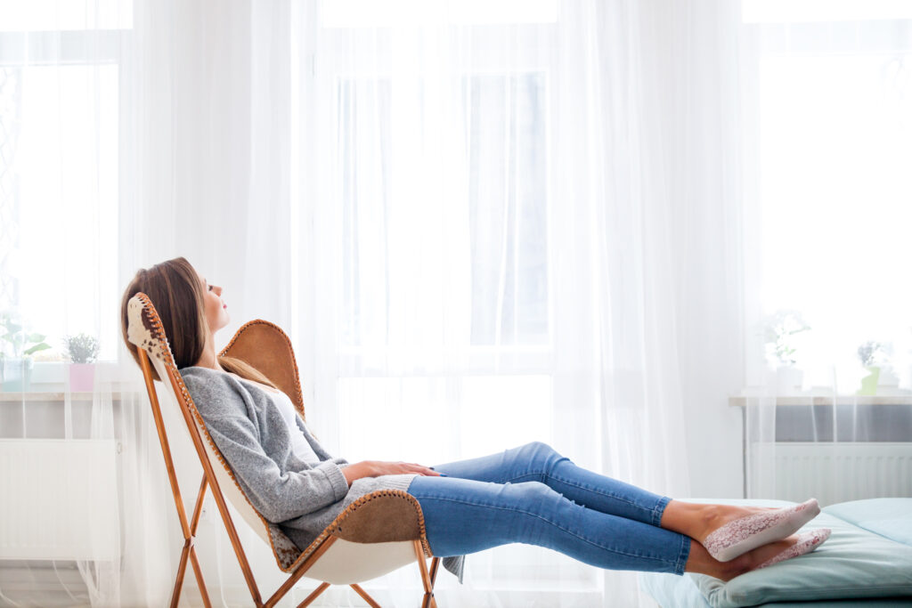 Woman relaxed at home with her insurance coverage